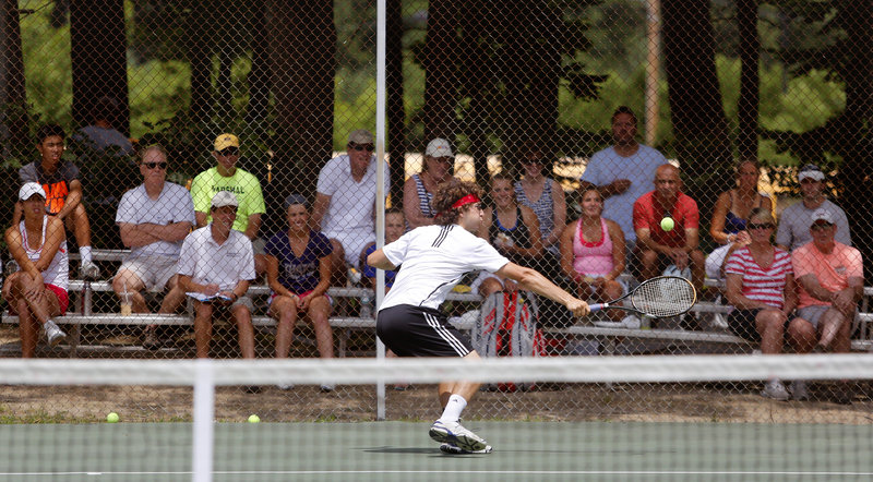 Noah Bragg of Brookline, Mass., makes a backhanded save against Luke Saunders of Halifax, Nova Scotia, en route to the men’s singles title Sunday afternoon at the Yarmouth High School courts – an event that attracted 226 players and was held at five sites for the six tournament brackets.