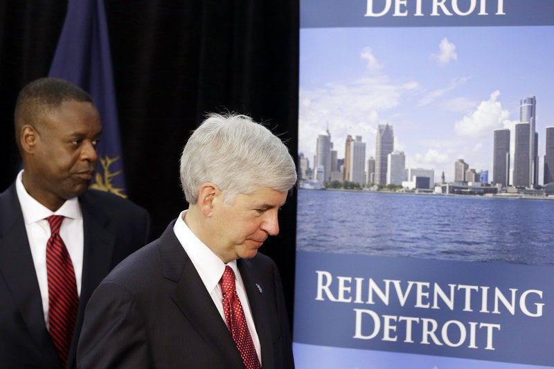 Michigan Gov. Rick Snyder, right, and state-appointed emergency manager Kevyn Orr leave a news conference in Detroit after addressing the city’s bankruptcy Thursday.