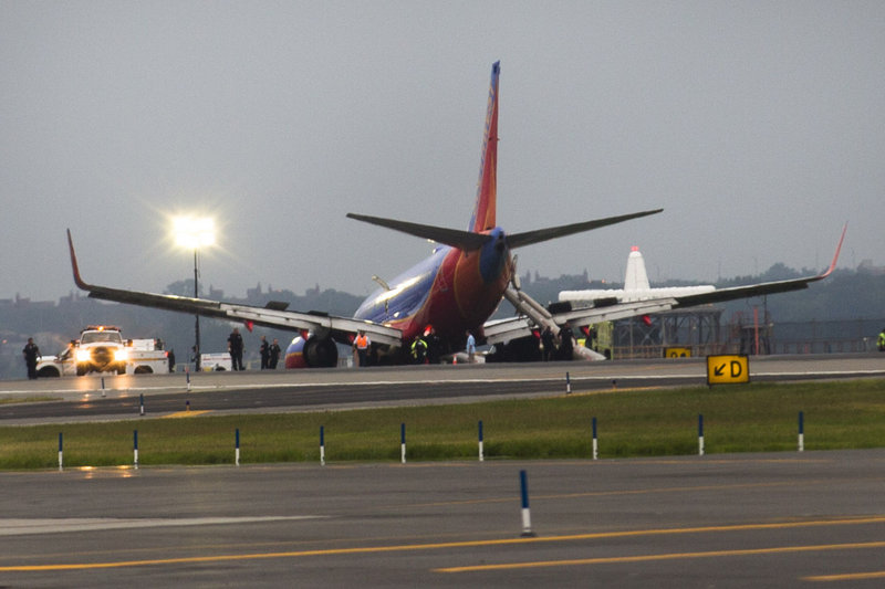 A Southwest Airlines jet rests on the tarmac after its front gear collapsed after landing Monday at LaGuardia Airport in New York.