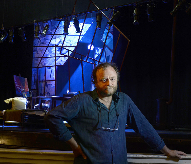 Chris Akerlind, a Tony Award-winning lighting designer who lives in Portland, poses for a portrait in front of the stage of "La Boheme" at Merrill Auditorium Monday, July 22, 2013. Akerlind designed the lighting for the show, the first time in near 20 years of living in Portland that he has worked in the city.