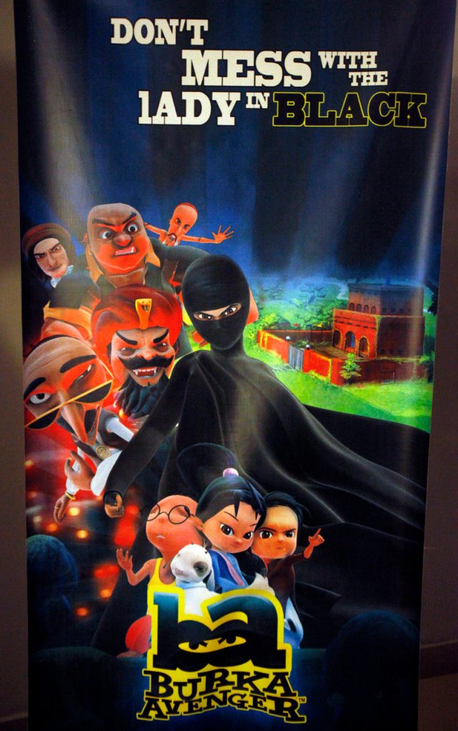 A poster of the “Burka Avenger” series is displayed Wednesday in Islamabad, Pakistan. Pop star Haroon conceived of the cartoon to emphasize the importance of girls’ education and teach children other lessons.