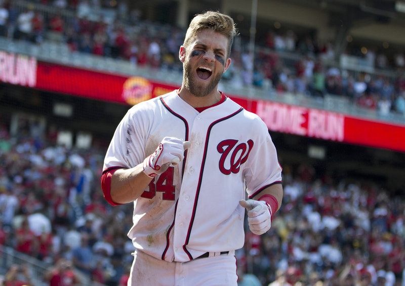 Washington’s Bryce Harper celebrates his game-winning two-run homer against the Pittsburgh Pirates on Thursday. The ninth-inning shot gave the Nationals a 9-7 victory.