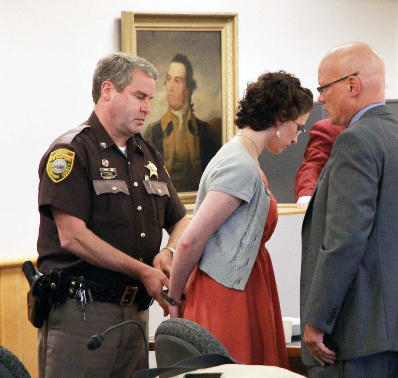 Kathryn "Kat" McDonough, 19, of Portsmouth, N.H., is led away after being sentenced at the Rockingham Superior Courthouse, Thursday, July 25, 2013 in Brentwood, N.H. McDonough, a New Hampshire woman charged with lying to investigators about the disappearance and death of a University of New Hampshire sophomore last fall has been sentenced to 1½ -3 years in prison. (AP Photo/The Herald, Rich Beauchesne)