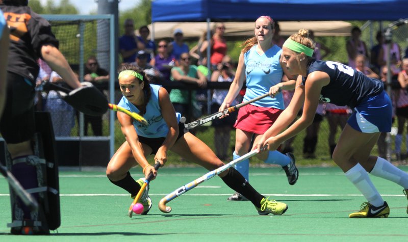 Kristy Bernatchez of Messalonskee tries to put a shot on goalie Patty Smith of Gorham while Sarah Sparks of Falmouth defends Saturday during the McNally Senior All-Star field hockey game. Bernatchez had a goal in the East’s 3-0 victory.