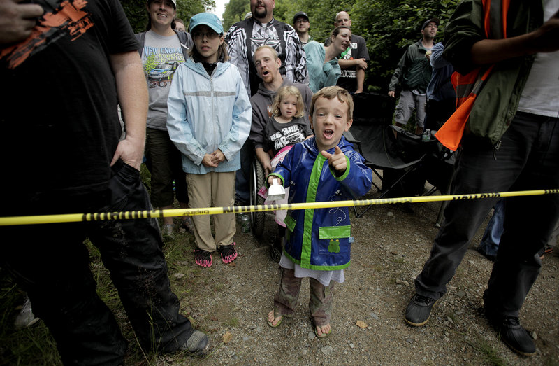 Aiden Gardner Baker, 5, cheers as he and other spectators watch racers during the Icicle Brook Stage on Friday.