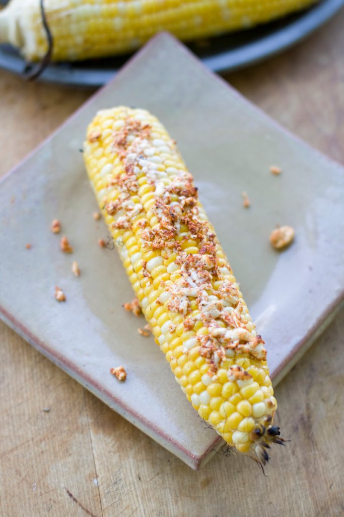 Shaved queso fresco makes grilled corn on the cob especially delicious.