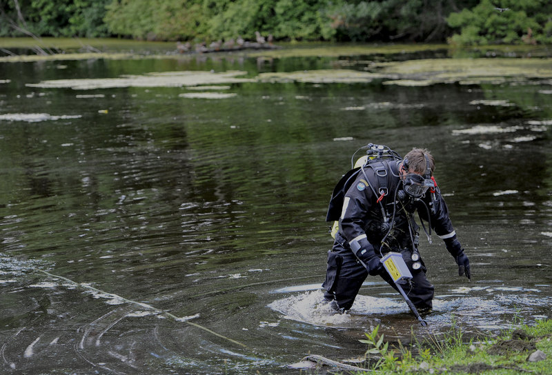 Connecticut State Police Dive Team search Pine Lake in Bristol, Conn., the hometown of the former New England Patriots player Aaron Hernandez, Monday, July 29, 2013. Hernandez has pleaded not guilty to murder in the death of Odin Lloyd, a 27-year-old Boston semi-professional football player. (AP Photo/Jessica Hill)