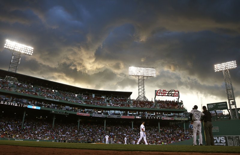 Clouds hang over Fenway Park during a game between the Red Sox and Rays on Monday.