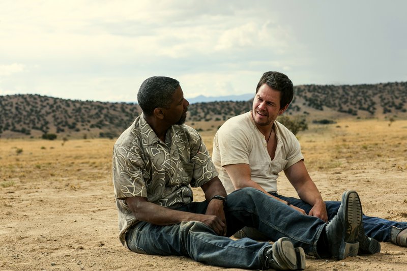 Denzel Washington, left, and Mark Wahlberg try to outfox each other in“2 Guns.”