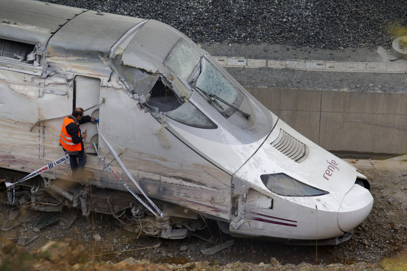 Investigators say the driver of this train – which crashed last Wednesday – was talking with a controller on a phone and consulting a document when the crash occurred.