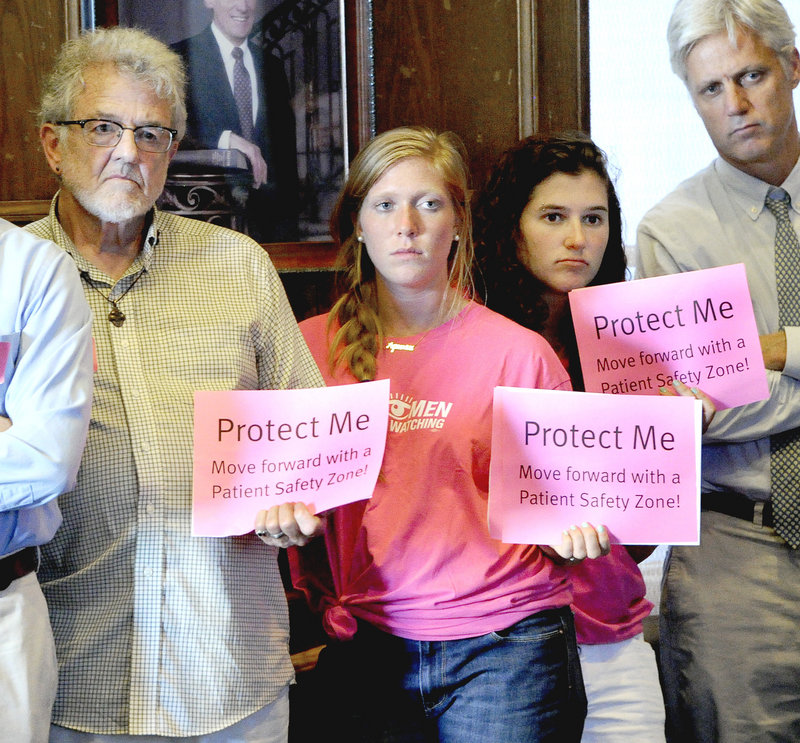 John Greenwood, R.N. from Kennebunk, Elizabeth Marcuse and Julia Springer, both from Cape Elizabeth were among the large crowd to attend Tuesday's meeting in support of a buffer zone to protect the clinic's patients.