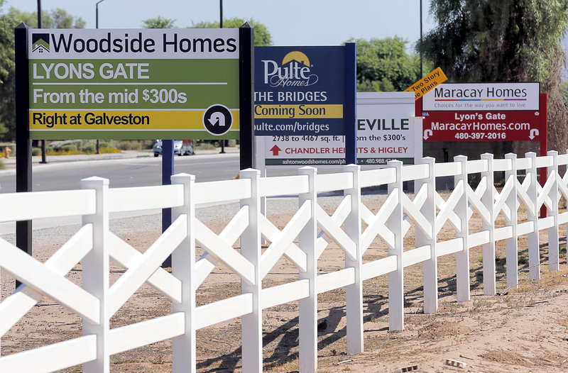 Home builders advertise Tuesday in Gilbert, Ariz. Home prices jumped 12.2 percent in May compared with a year ago, the biggest gain since March 2006. The biggest price gains are occurring in states that experienced the worst housing bust.