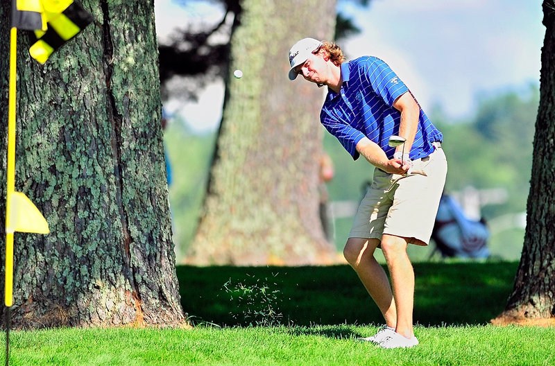 Evan Harmeling chips onto a green on the back nine Tuesday in winning the Maine Open by a stroke.