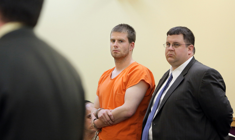 Bryan Wood and his attorney Steven Carey listen to Assistant District Attorney Neil McLean during Wood's arraignment on May 13, 2013, in Lewiston District Court.