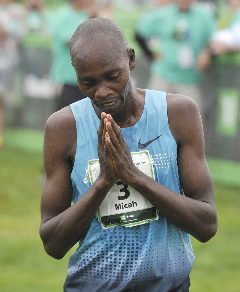 Race winner Micah Kogo, from Kenya, takes a moment to reflect after winning Saturday's Beach to Beacon at Cape Elizabeth on Saturday.