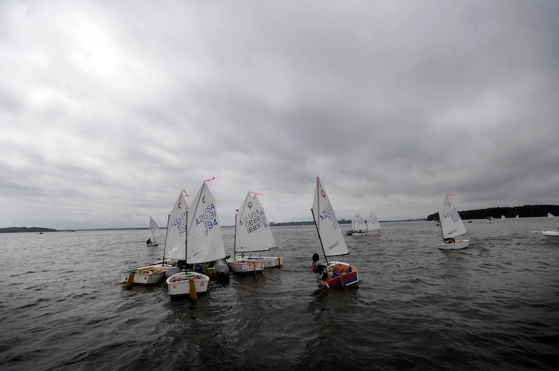 Competitors wait in Casco Bay for the start of the 2013 U.S. Optimist Dinghy Association's New England Championship Regatta on Thursday, August 8, 2013.