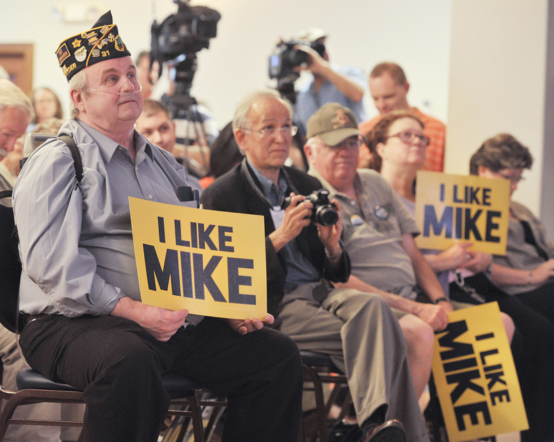 Phil Nelsen of Lewiston listens to U.S. Rep. Mike Michaud announce his candidacy for governor at the Franco-American Heritage Center in Lewiston on Thursday.
