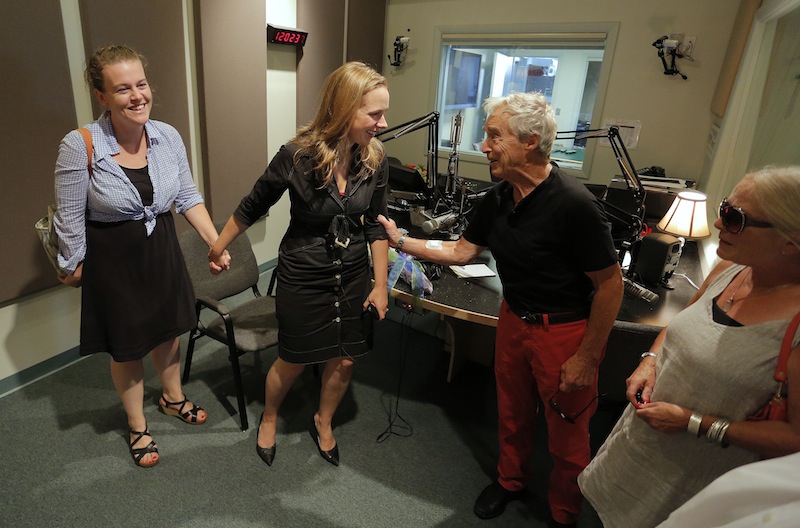 Suzanne Nance, center, in black, shares a moment with friends Kate Cox, at left, and Frank and Sharon Reilly, at right, after Nance signed off of her last broadcast as host of "Morning Classical" on MPBN Friday, August 23, 2013.