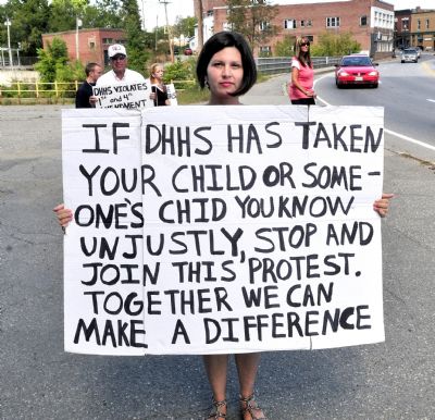 BethMarie Retamozzo protests against the state Department of Health and Human Services in Skowhegan on Aug. 31, 2012. Retamozzo is accused of abducting her children during a supervised visit on Thursday. She and the children were found in South Carolina on Saturday.