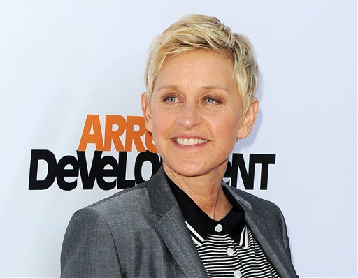 In this April 29, 2013 file photo, TV host Ellen DeGeneres arrives at the season 4 premiere of "Arrested Development" in Los Angeles. Producers announced Friday that DeGeneres will return to host the Oscars on March 2, 2014. Blonde Hair,Gray Jacket,Grey Blazer,One Person,Portrait,Short Hair,Short Sleeved,Short Sleeves,Smiling,Stripe Pattern,Striped Tee Shirt,Striped T-shirt,Stripes,Three Quarter Length