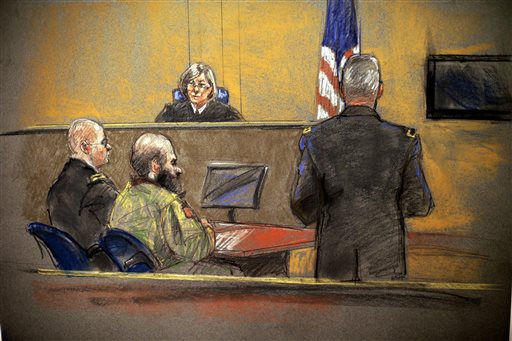 In this courtroom sketch, Maj. Nidal Hasan, center, sits before the judge, U.S. Army Col. Tara Osborn, during the sentencing phase of his trial in Fort Hood, Texas.