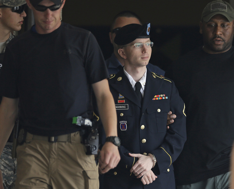 Army Pfc. Bradley Manning is escorted out of a courthouse in Fort Meade, Md., on July 30.