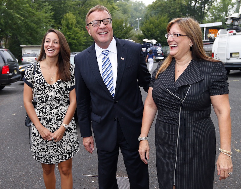 Republican U.S. Senate candidate Steve Lonegan arrives at the Bogota Recreation Center to vote with his daughter Brooke, left, and wife, Lorraine, in the special election primary in Bogota, N.J., Tuesday, Aug. 13, 2013. (AP Photo/Rich Schultz)