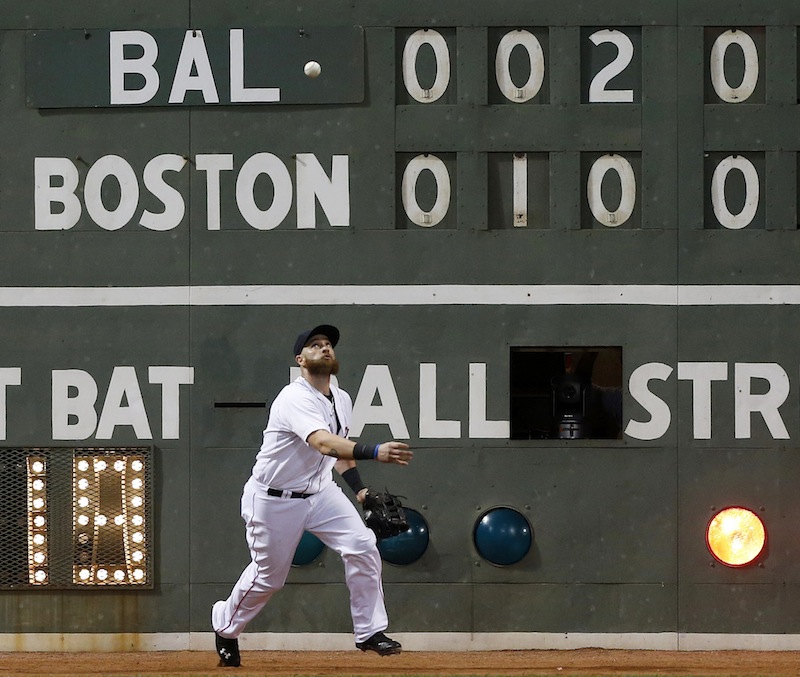 Boston's Jonny Gomes fields the one-run double off the wall by Baltimore's Chris Davis in the fifth inning Thursday.