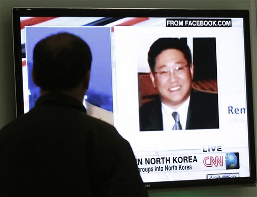 A South Korean man watches a television news program showing Korean American Kenneth Bae at the Seoul Railway Station in South Korea in this May 2, 2013, photo. Bae has been sentenced by North Korea to 15 years of hard labor for "hostile acts" against the state.