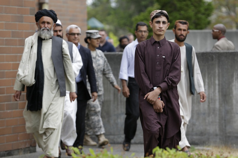 Afghan villagers wait to head to a news conference after a sentencing hearing for Staff Sgt. Robert Bales at Joint Base Lewis-McChord, Wash., on Friday, Aug. 23, 2013. Bales, who massacred 16 Afghan civilians in 2012 in one of the worst atrocities of the Iraq and Afghanistan wars, was sentenced Friday to life in prison with no chance of parole. (AP Photo/Elaine Thompson)