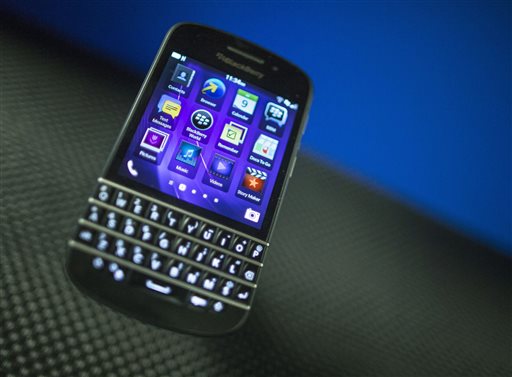 A BlackBerry Q10 is displayed recently at a company' meeting, in Waterloo, Ontario. Struggling smartphone maker BlackBerry will consider selling itself. The Canadian company is exploring "strategic alternatives" in hopes of boosting Q10 sales.