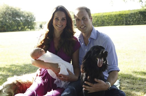 This image taken by Michael Middleton, the Duchess's father, in early August 2013 and supplied by Kensington Palace, shows the Duke and Duchess of Cambridge with their son, Prince George, in the garden of the Middleton family home in Bucklebury, England, with Tilly the retriever, seen left, a Middleton family pet, and Lupo, the couple's cocker spaniel.