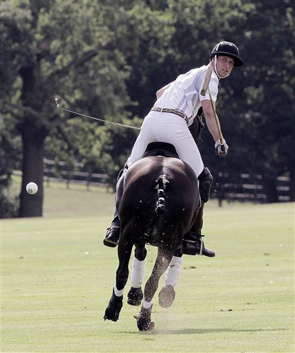 Britain's Prince William plays in a charity polo match, at Coworth Park, near Ascot, England, Saturday. Prince William played alongside brother Prince Harry.