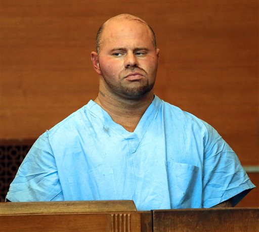 Jared Remy appears at Waltham District Court for his arraignment on Friday in Waltham, Mass. He is being held without bail after pleading not guilty to fatally stabbing his girlfriend, 27-year-old Jennifer Martel, at his home.