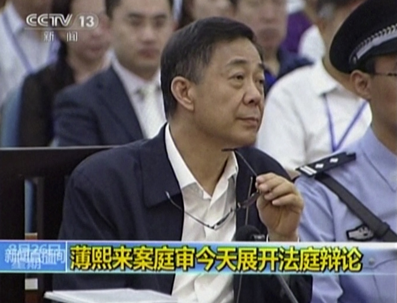 In this image taken from video, former Chinese politician Bo Xilai looks up in a courtroom at Jinan Intermediate People's Court in Jinan, eastern China's Shandong province, on Monday.