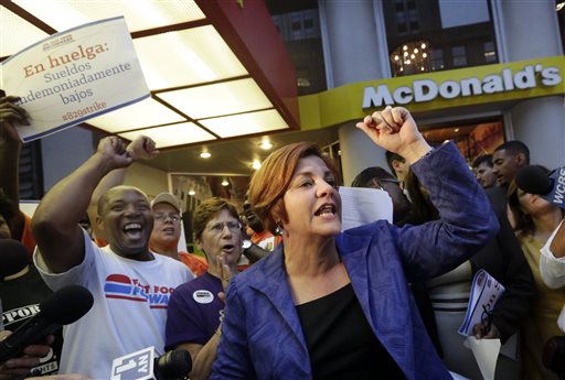 New York City Council Speaker and mayoral candidate Christine Quinn speaks at a fast-food workers' protest outside a McDonald's restaurant on New York's Fifth Avenue on Thursday.