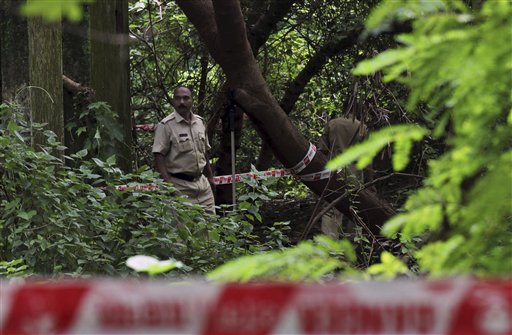 Indian policemen inspect the site where a 22-year-old woman was gang raped in Mahalaxmi area in Mumbai, India.
