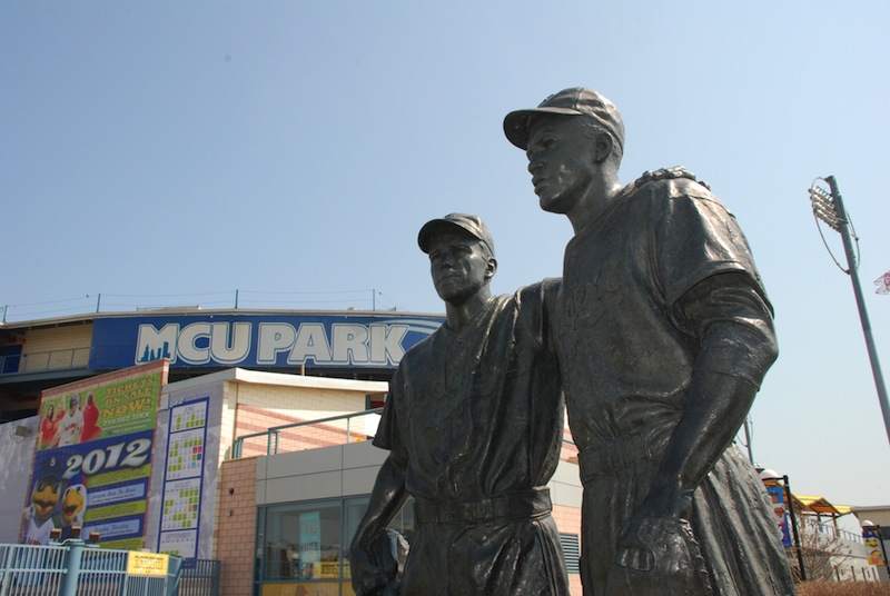 A statue of Pee Wee Reese and Jackie Robinson at MCU Park in the Coney Island section of the Brooklyn borough of New York. New York City police are investigating swastikas and hate speech scrawled on the statue outside Brooklyn's minor league baseball stadium. A manager at MCU Park noticed the defacement Wednesday morning, Aug. 7, 2013. (AP Photo/Brooklyn Cyclones)