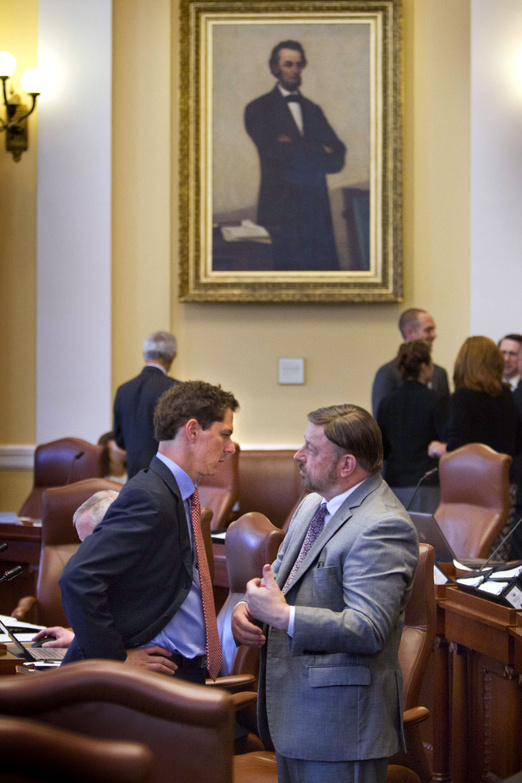 Senate president Justin Alfond, left, confers with Sen. John Cleveland, D-Androscoggin County, in the Maine Senate on Thursday at the State House in Augusta, when lawmakers returned for a special session to vote for a $149.5 million bond package slated for the November ballot.