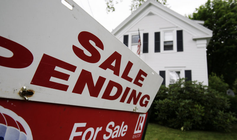In this 2011 file photo, a sale pending sign is set outside a house in Bath, Maine. Sales of existing single-family homes in Maine surged more than 31 percent in July 2013 over the same month last year, outpacing strong gains in both the Northeast and nationally for the same period. (AP Photo/Pat Wellenbach)