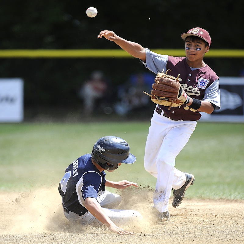 South Burlington Vermont's Ryan Sargent (4) is forced out at second by Saco Maine's Anthony Bracamonte (15) during the 2013 Eastern Regional Little League Tournament at Breen Field in Bristol on Tuesday. Despite a 1-3 record in pool play, the Saco Little League team has advanced to the semifinals.