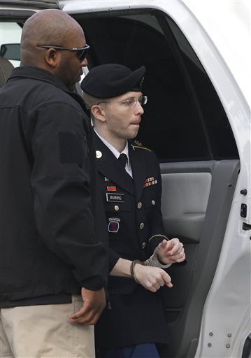 Army Pfc. Bradley Manning steps out of a security vehicle as he is escorted into a courthouse in Fort Meade, Md., Wednesday.
