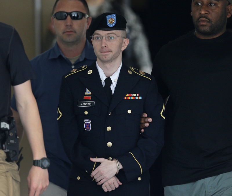 Army Pfc. Bradley Manning is escorted out of a courthouse in Fort Meade, Md., last month. He spoke at his sentencing hearing Wednesday.