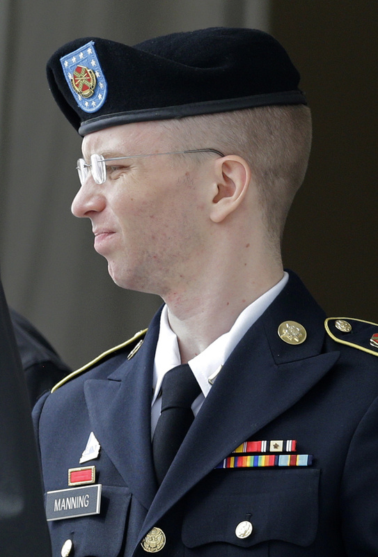 Army Pfc. Bradley Manning is escorted to a security vehicle outside a courthouse in Fort Meade, Md., on Friday after a hearing in his court martial.