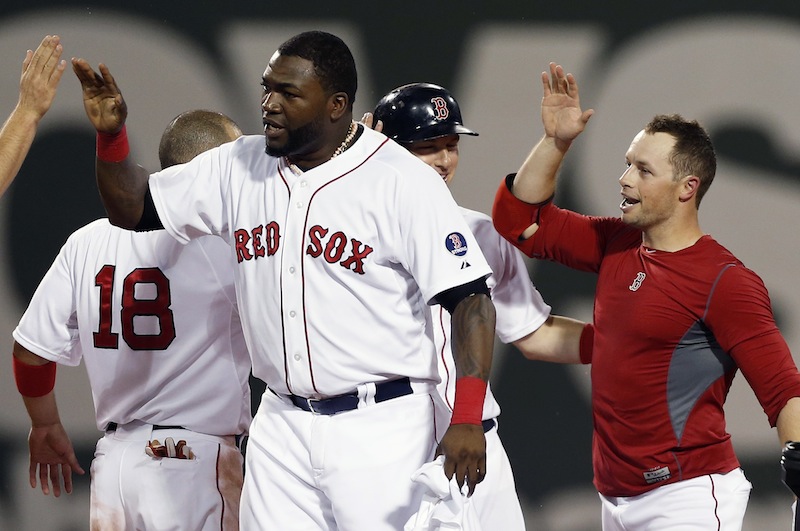 Boston Red Sox's Daniel Nava, right, celebrates his RBI single that drove in the winning run in the ninth inning of a baseball game against the Seattle Mariners in Boston, Thursday, Aug. 1, 2013. The Red Sox won 8-7. (AP Photo/Michael Dwyer)