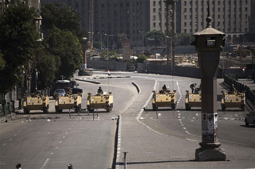 Egyptian army soldiers in armored vehicles block Tahrir Square in Cairo on Friday.