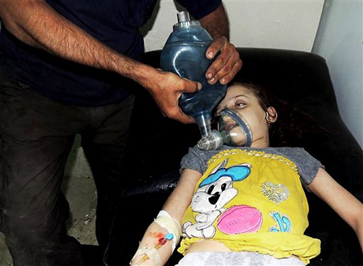 This citizen journalism image provided by the Local Committee of Arbeen shows a Syrian girl receiving treatment at a makeshift hospital, in Arbeen, Damascus, Syria, on Wednesday. The image has been authenticated based on its contents and other AP reporting.