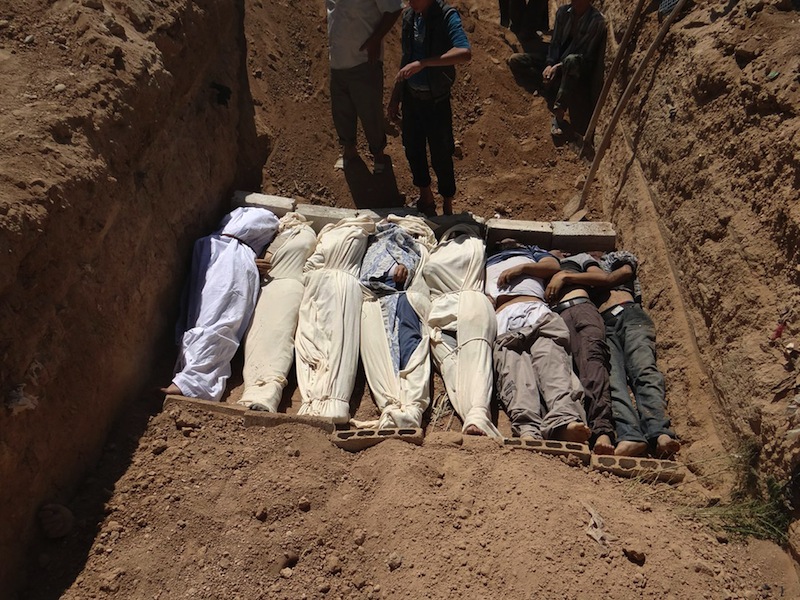 This Aug. 21, 2013, file image provided by by Shaam News Network, which has been authenticated based on its contents and other AP reporting, purports to show several bodies being buried during a funeral in a suburb of Damascus, Syria. A senior administration official said Sunday, Aug. 25, 2013, that there is “very little doubt” that a chemical weapon was used by the Syrian regime against civilians in an incident that killed at least a hundred people last week, but added that the president had not yet decided how to respond. (AP Photo/Shaam News Network, File)
