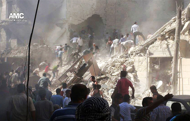 In this citizen journalism image, which has been authenticated based on its contents and other AP reporting, Syrians inspect the rubble of damaged buildings due to heavy shelling by Syrian government forces in Aleppo, Syria, on Monday.