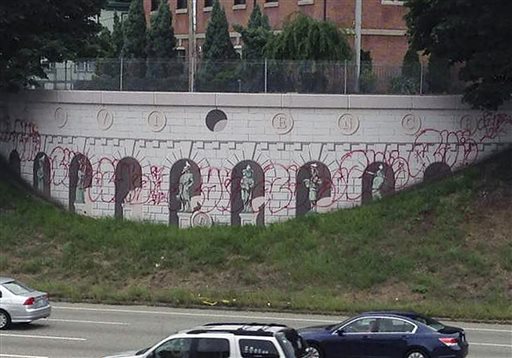 This mural along I-95 in Providence, R.I., is one of two designed by children's author and illustrator David Macauley as part of a program to reduce vandalism. The Rhode Island Department of Transportation discovered it defaced with graffiti on Tuesday.